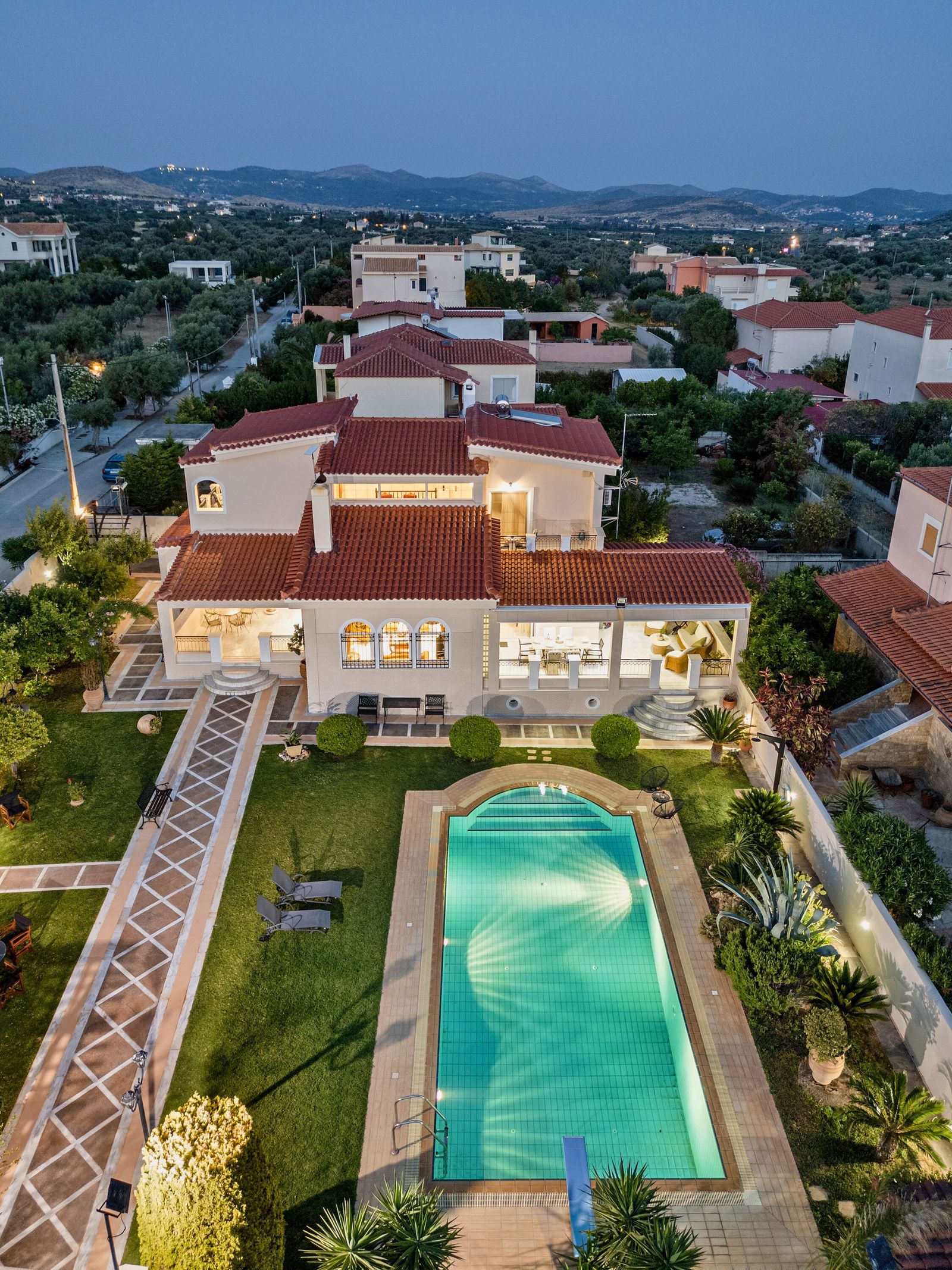Aerial view of pool and garden at dusk, Lagonisi