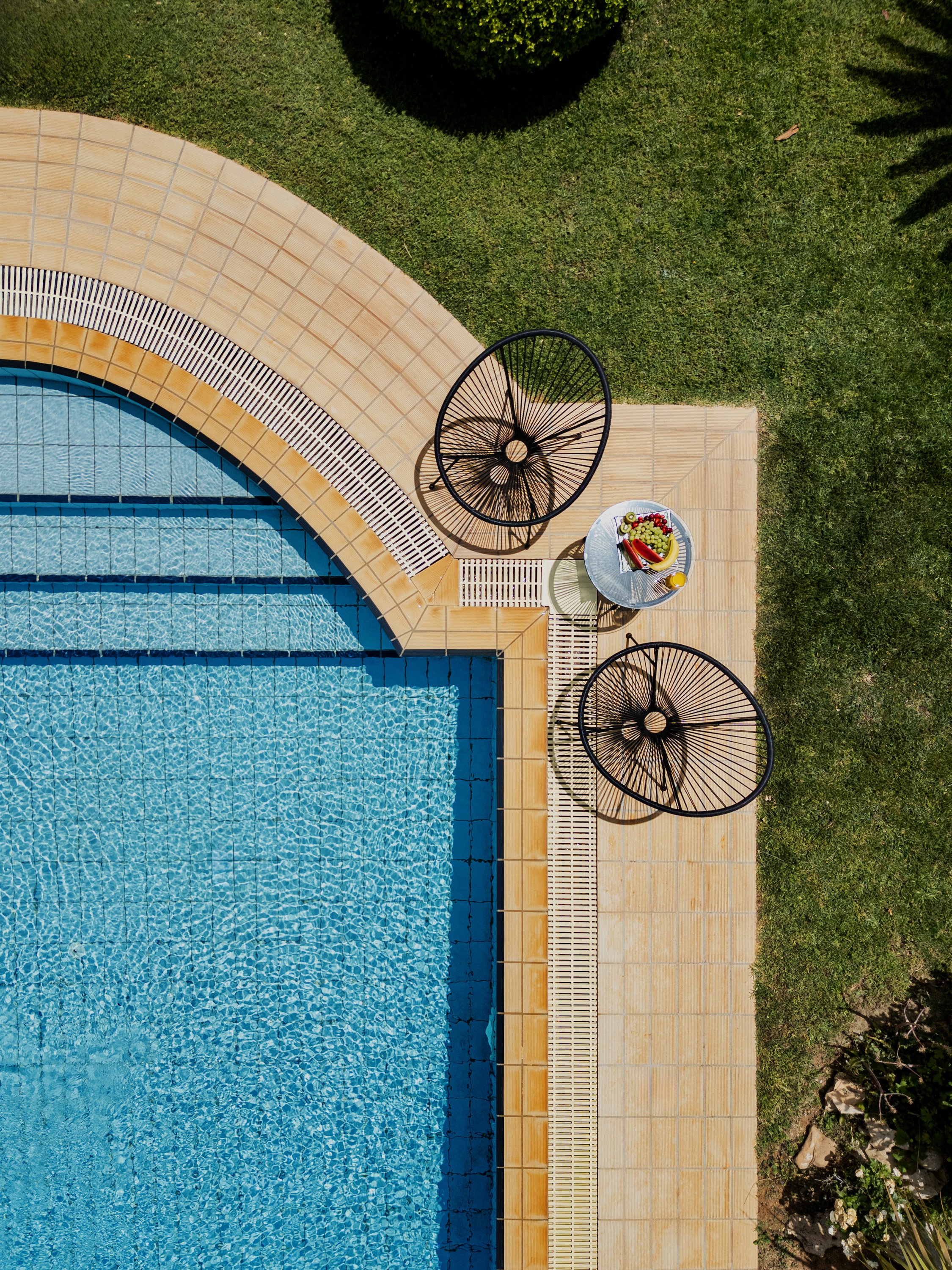 Aerial view of Renko Royal Villa infinity pool and Mediterranean garden, Athens, Greece